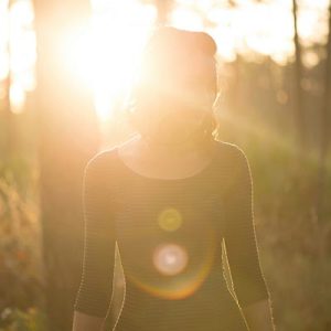 woman-standing-in-a-sun-flare